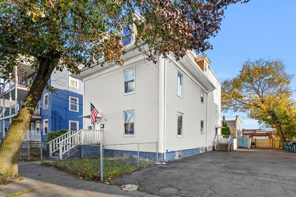 90 Timson Street Lynn, MA 01902 - Photo 2 of 38 a white house that has a tree in front of it