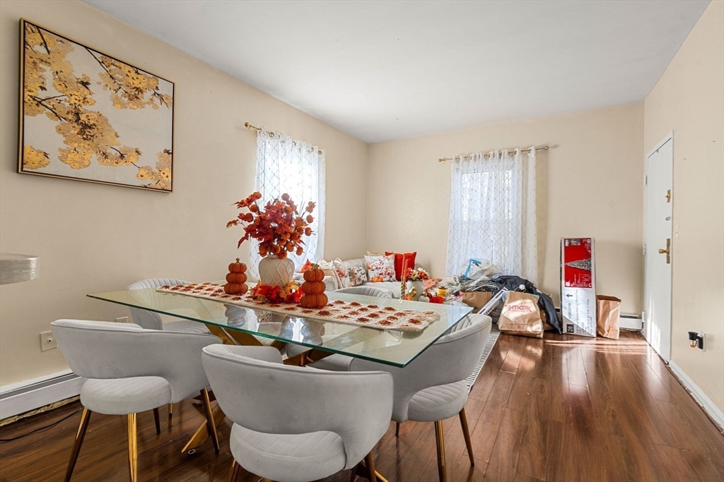 90 Timson Street Lynn, MA 01902 - Photo 21 of 38 a dining room with furniture and wooden floor