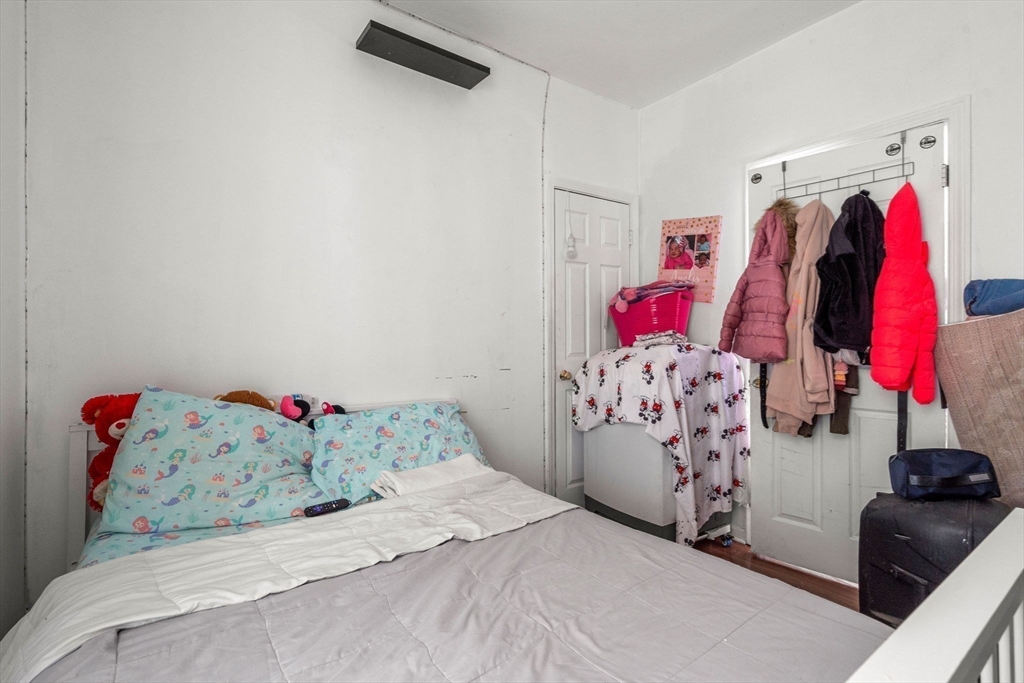 90 Timson Street Lynn, MA 01902 - Photo 27 of 38 a bedroom with a bed and a bed
