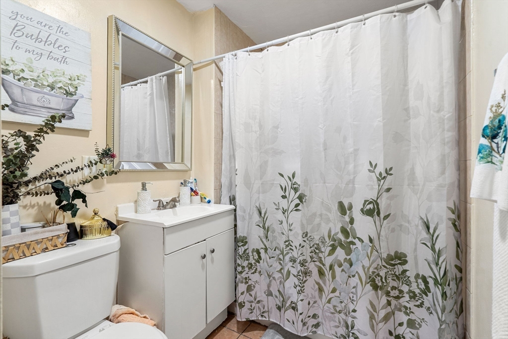 90 Timson Street Lynn, MA 01902 - Photo 28 of 38 a view of a bathroom with sink and mirror