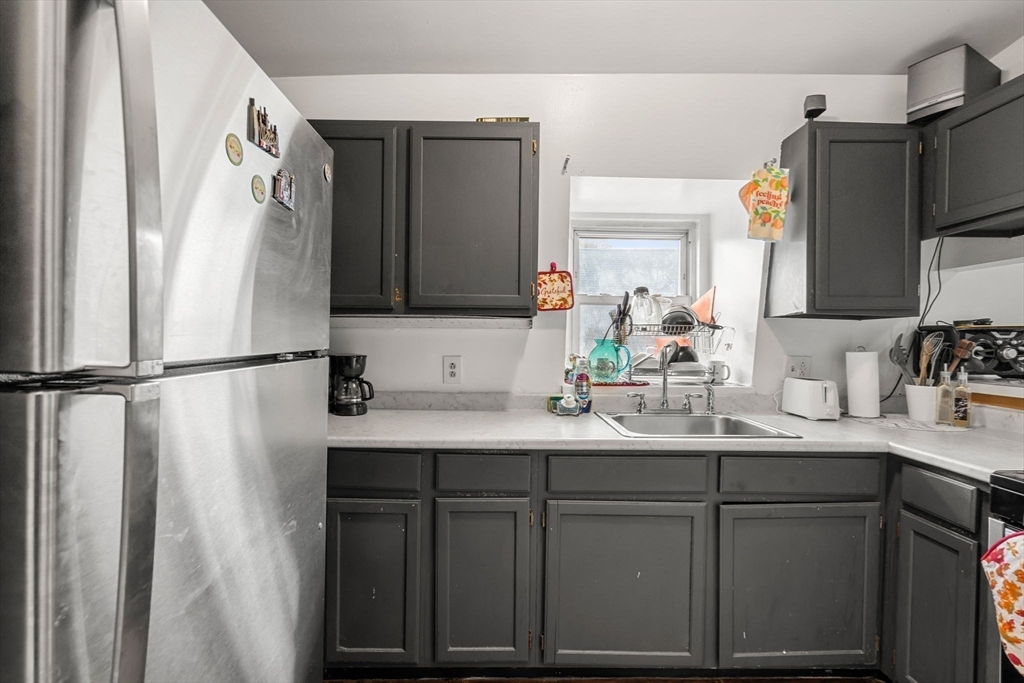 90 Timson Street Lynn, MA 01902 - Photo 34 of 38 a bathroom with a sink and a mirror