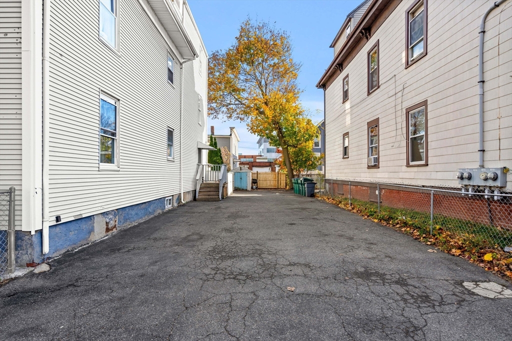 90 Timson Street Lynn, MA 01902 - Photo 4 of 38 a view of a house with a yard