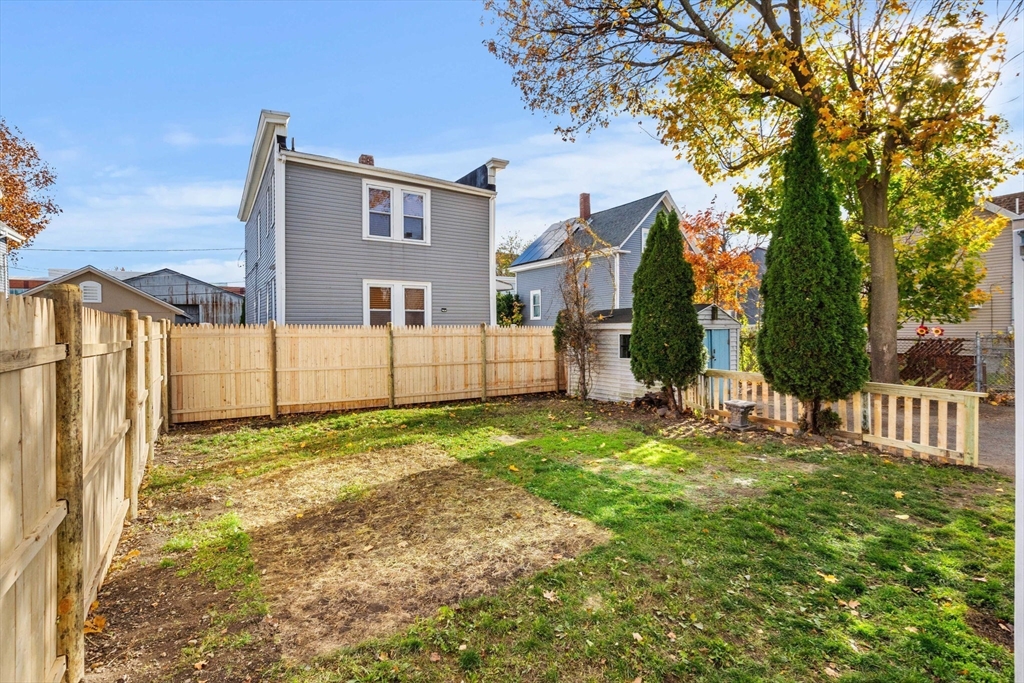 90 Timson Street Lynn, MA 01902 - Photo 6 of 38 a view of a back yard of the house