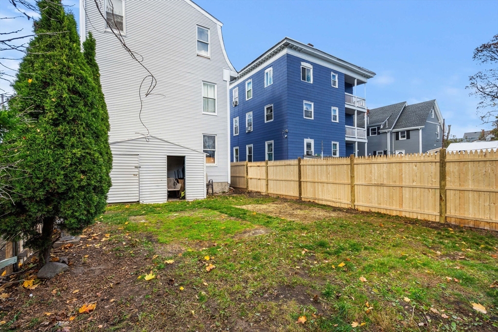 90 Timson Street Lynn, MA 01902 - Photo 7 of 38 a view of a backyard of the house