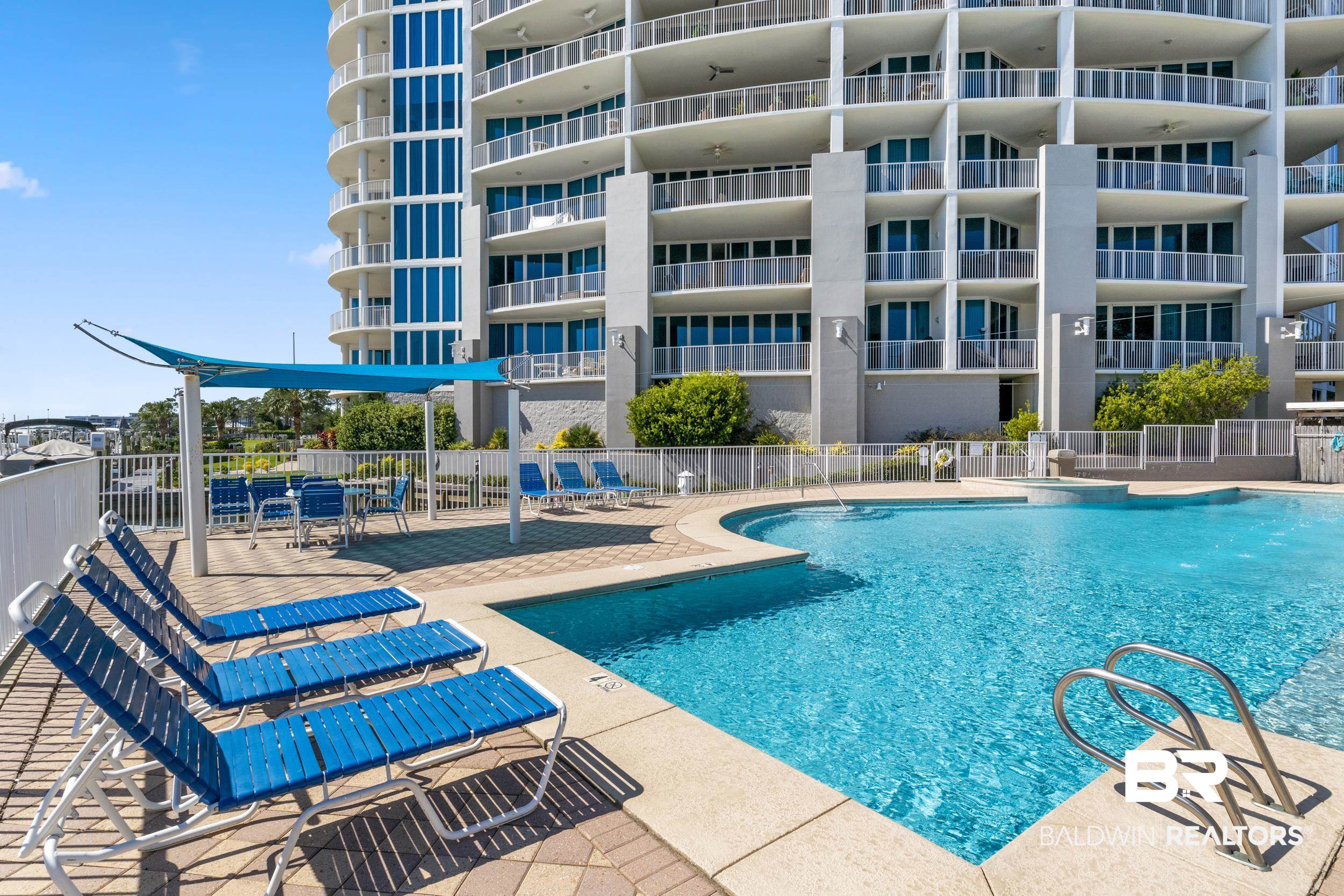 28250 Canal Road, Unit 307 Orange Beach, AL 36561 - Photo 10 of 56 Community pool with a patio area