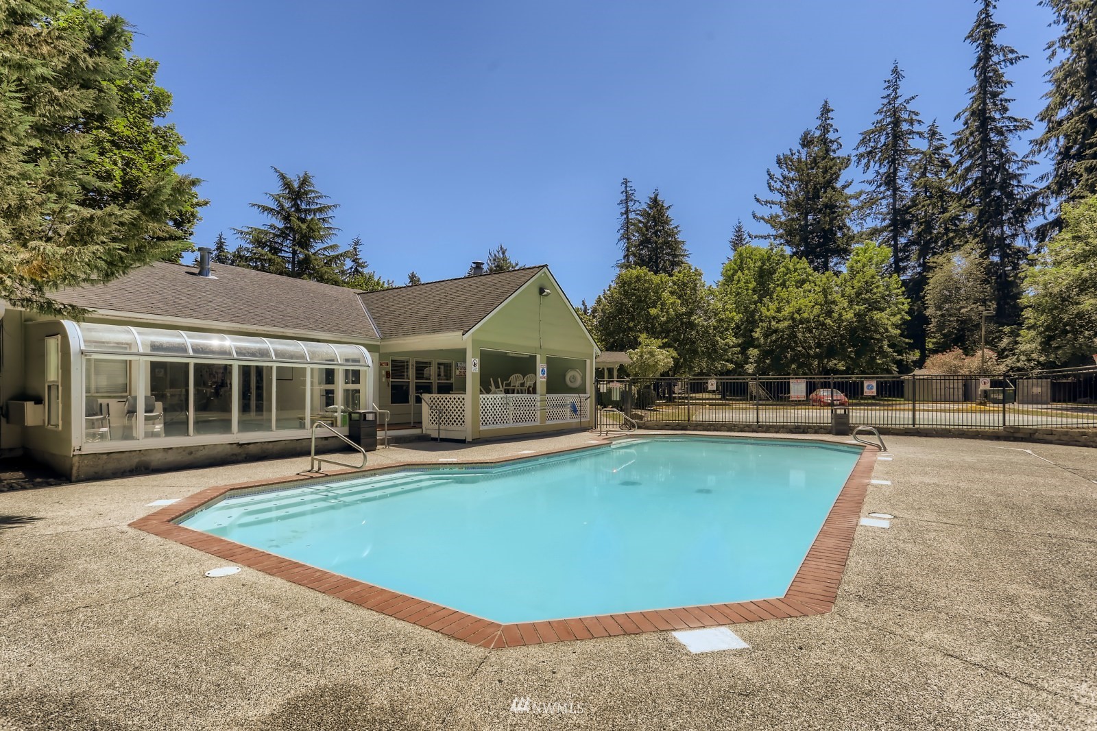 9805 Avondale Road Northeast, Unit X162 Redmond, WA 98052 - Photo 17 of 19 a view of a house with pool fire pit and a yard in the back
