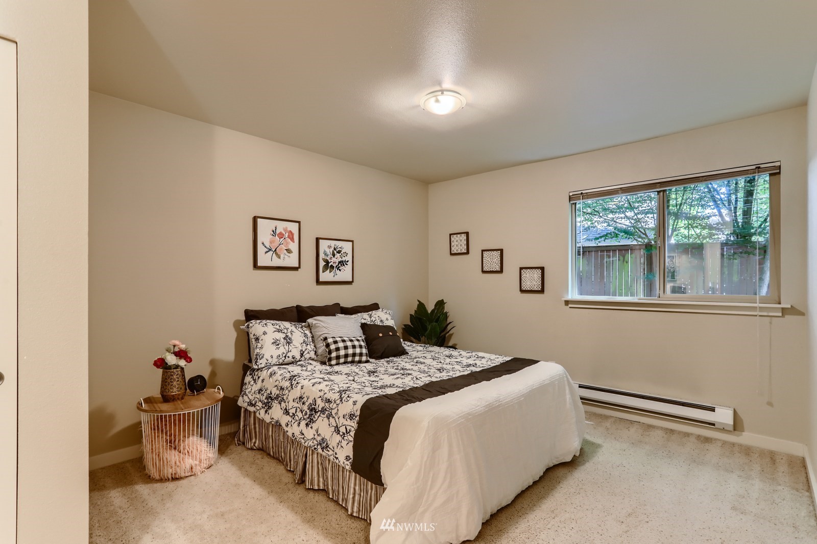 9805 Avondale Road Northeast, Unit X162 Redmond, WA 98052 - Photo 6 of 19 a bedroom with a large bed and a window