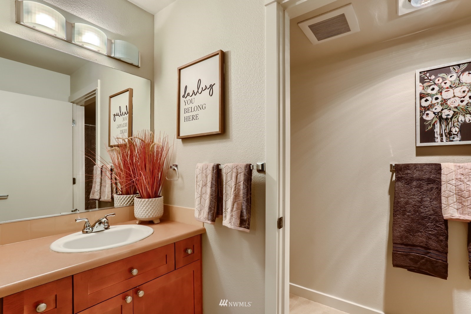 9805 Avondale Road Northeast, Unit X162 Redmond, WA 98052 - Photo 8 of 19 a bathroom with a sink and mirror