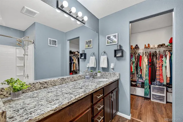a view of a kitchen island with furniture and wooden floor