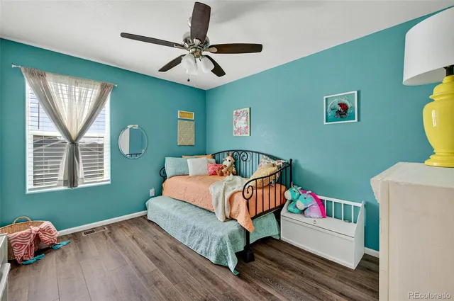 a bed room with furniture and a window