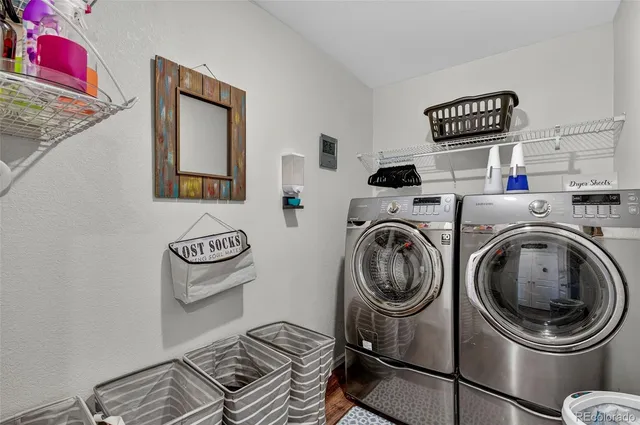 a view of storage and utility room with washer and dryer