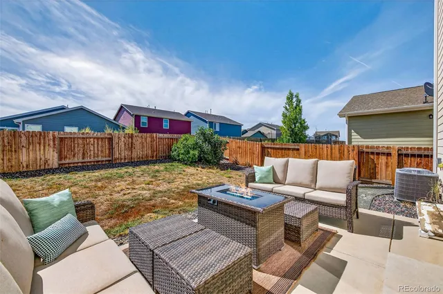 a outdoor space with patio couches and a potted plant