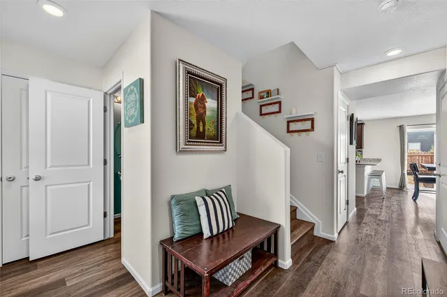 a view of a livingroom with furniture and wooden floor