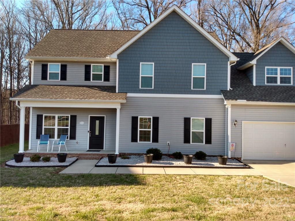 1114 Turtle Ridge Drive Monroe, NC 28110 - Photo 1 of 7 a view of a house with swimming pool and a yard