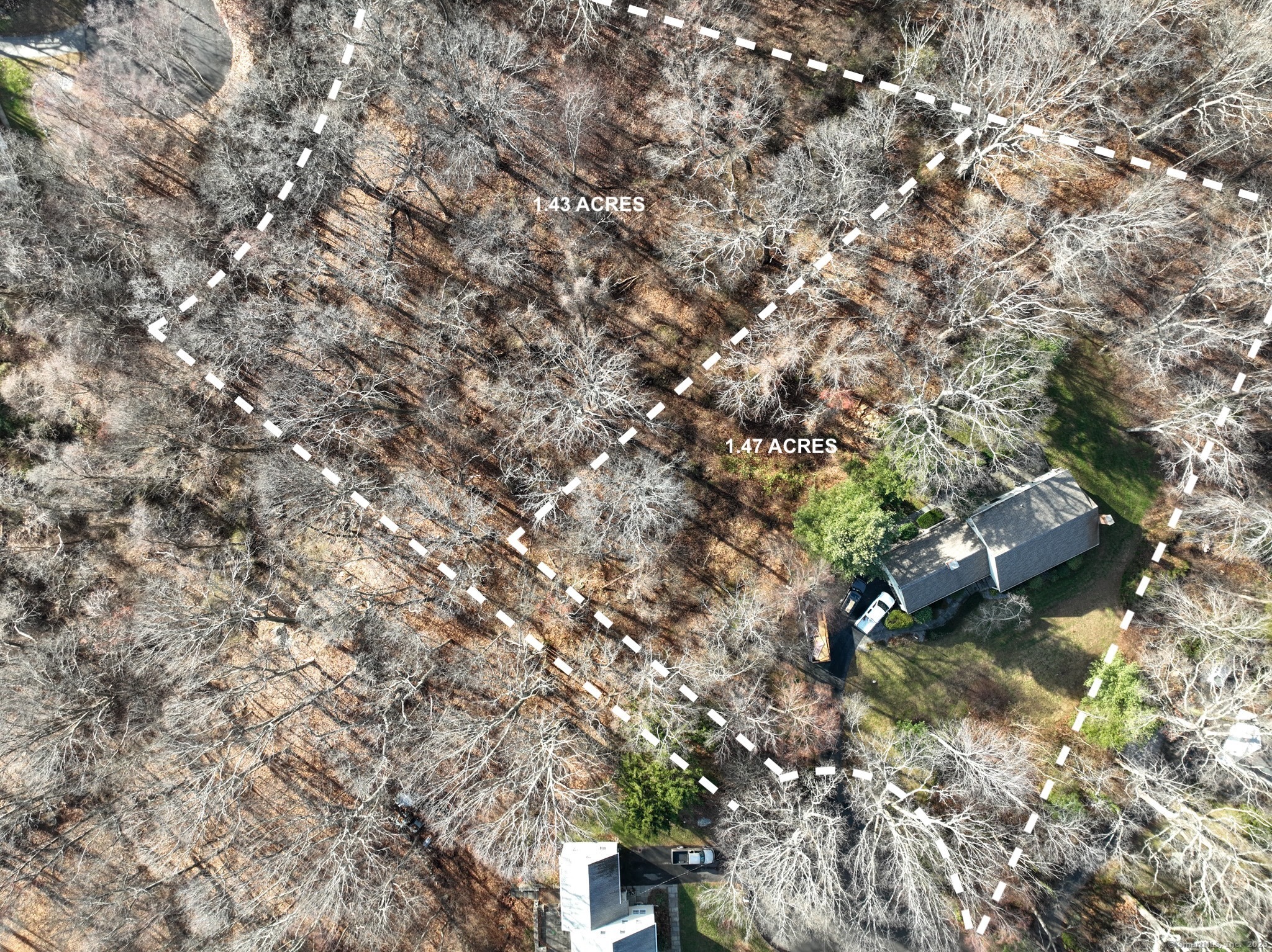 a backyard of a house with a yard and outdoor seating
