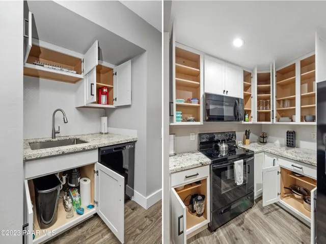 a kitchen with stainless steel appliances granite countertop a stove and a sink
