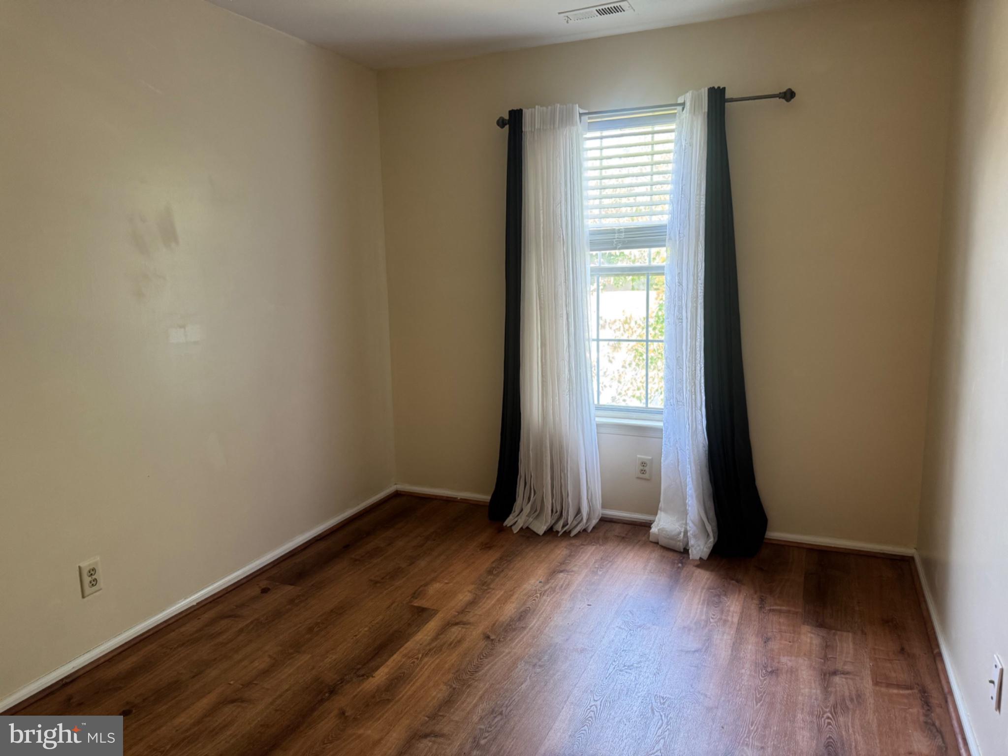 1908 B Ralston Drive Mount Laurel, NJ 08054 - Photo 9 of 21 an empty room with wooden floor and windows