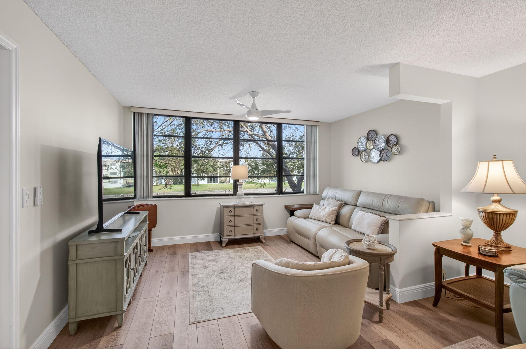 15074 Witney Road, Unit 204 Delray Beach, FL 33484 - Photo 12 of 56 a living room with furniture and a large window