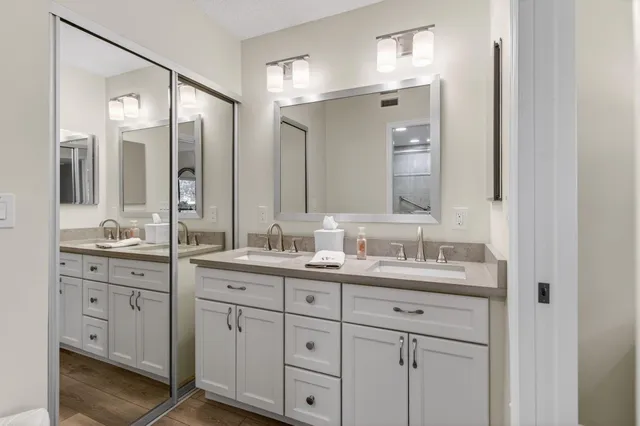 a bathroom with a sink toilet and shower