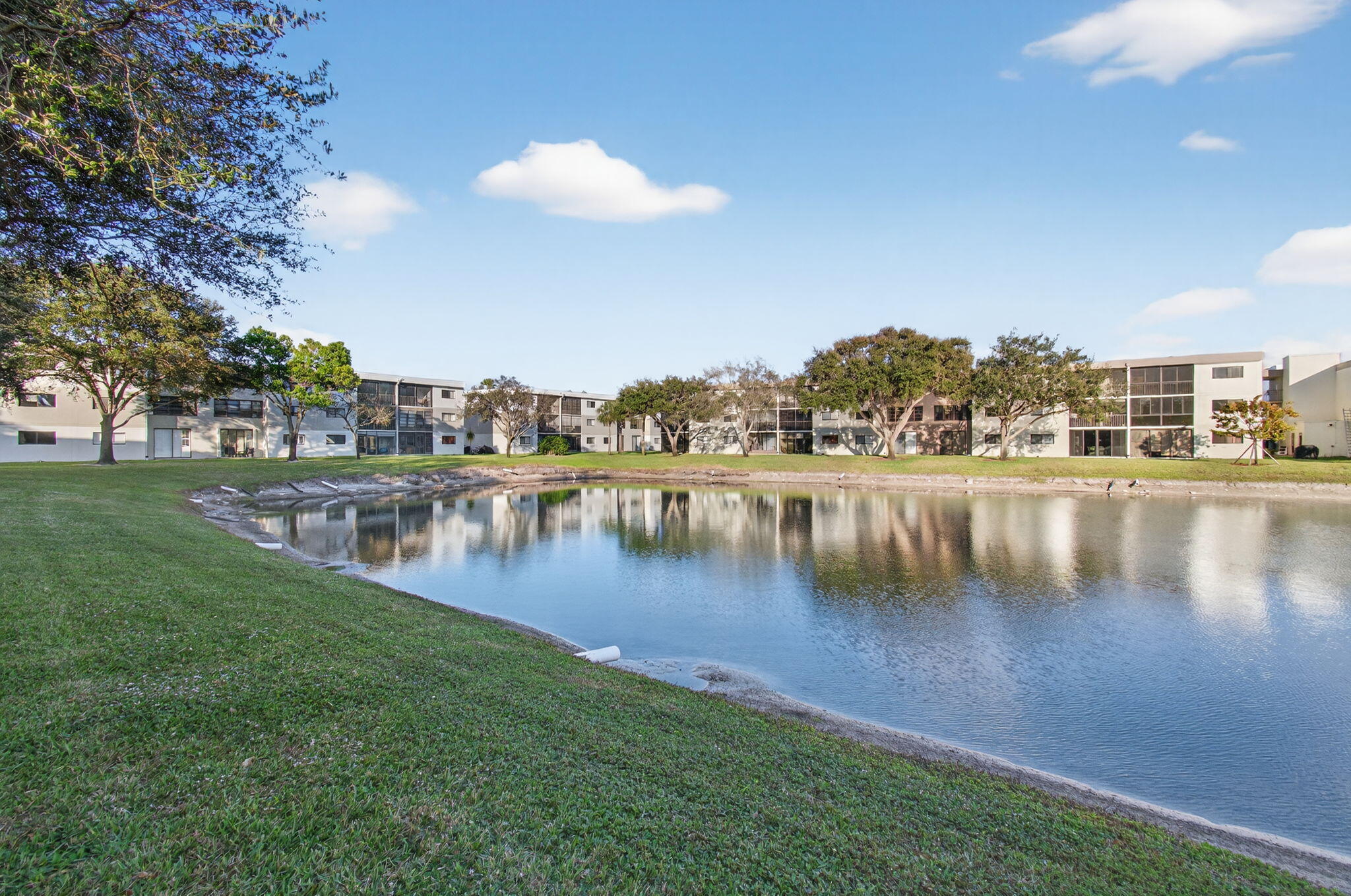 15074 Witney Road, Unit 204 Delray Beach, FL 33484 - Photo 43 of 56 a view of a lake with houses