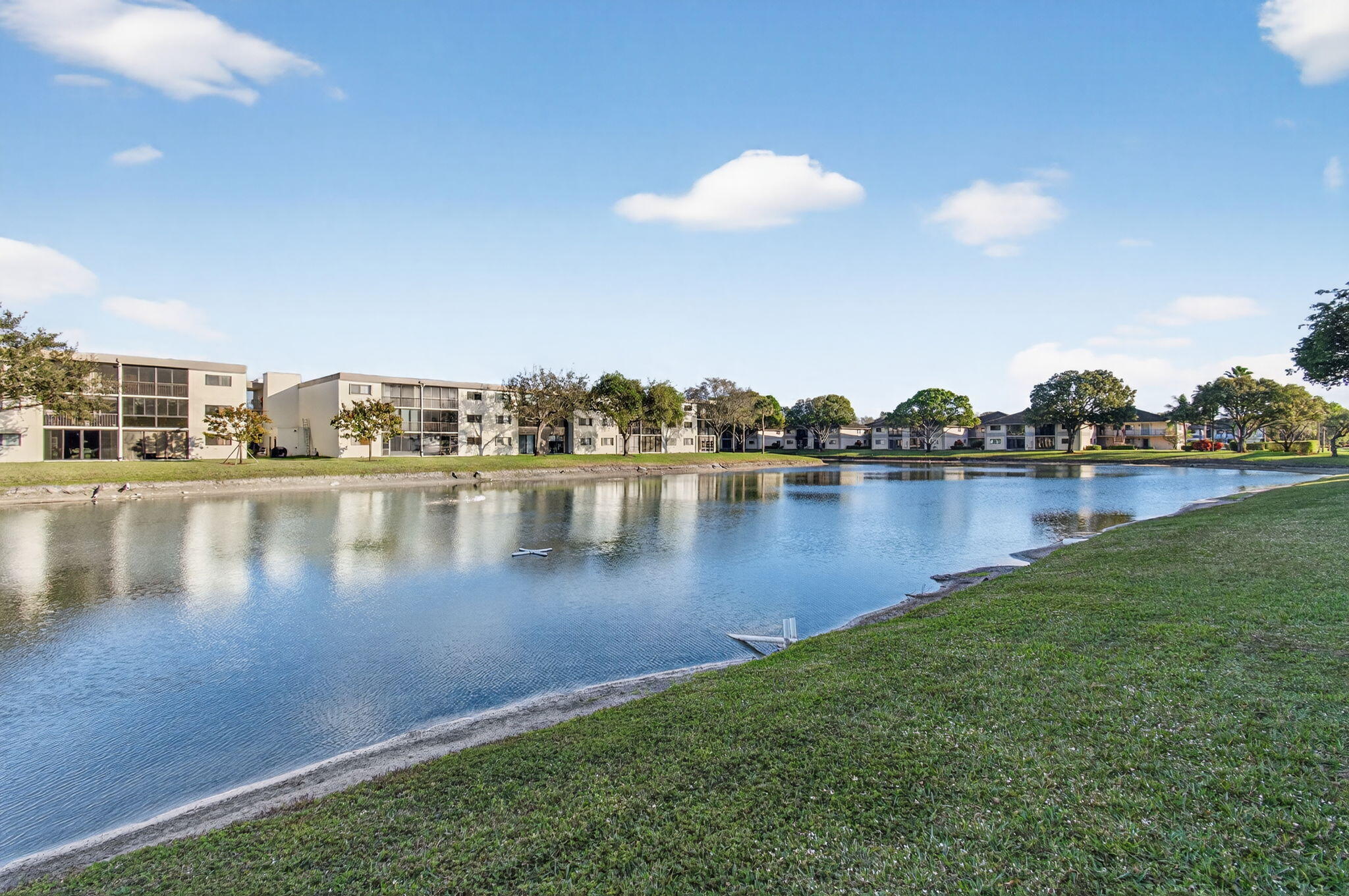 15074 Witney Road, Unit 204 Delray Beach, FL 33484 - Photo 44 of 56 a view of a lake with houses
