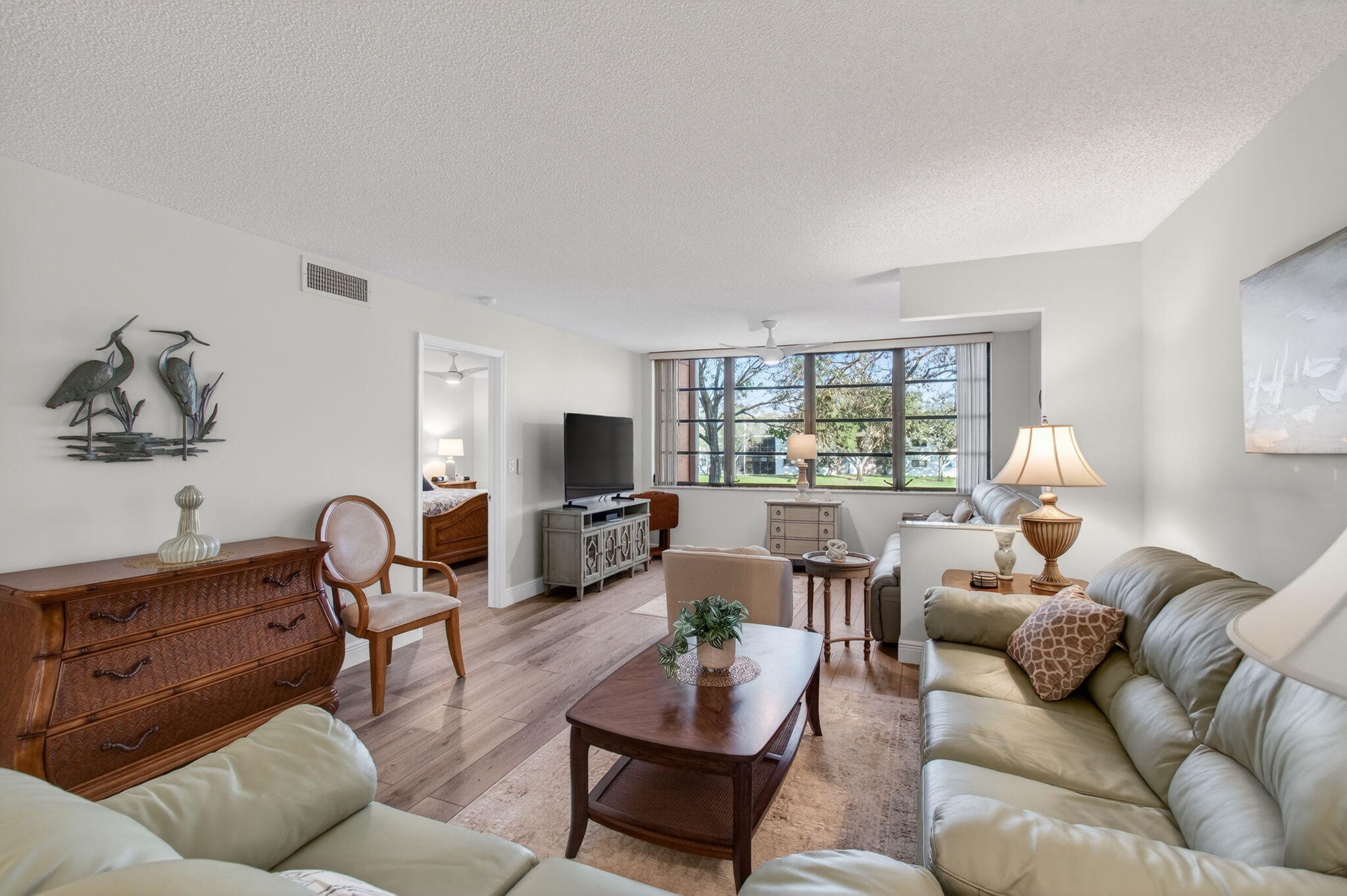 15074 Witney Road, Unit 204 Delray Beach, FL 33484 - Photo 9 of 56 a living room with furniture and a large window