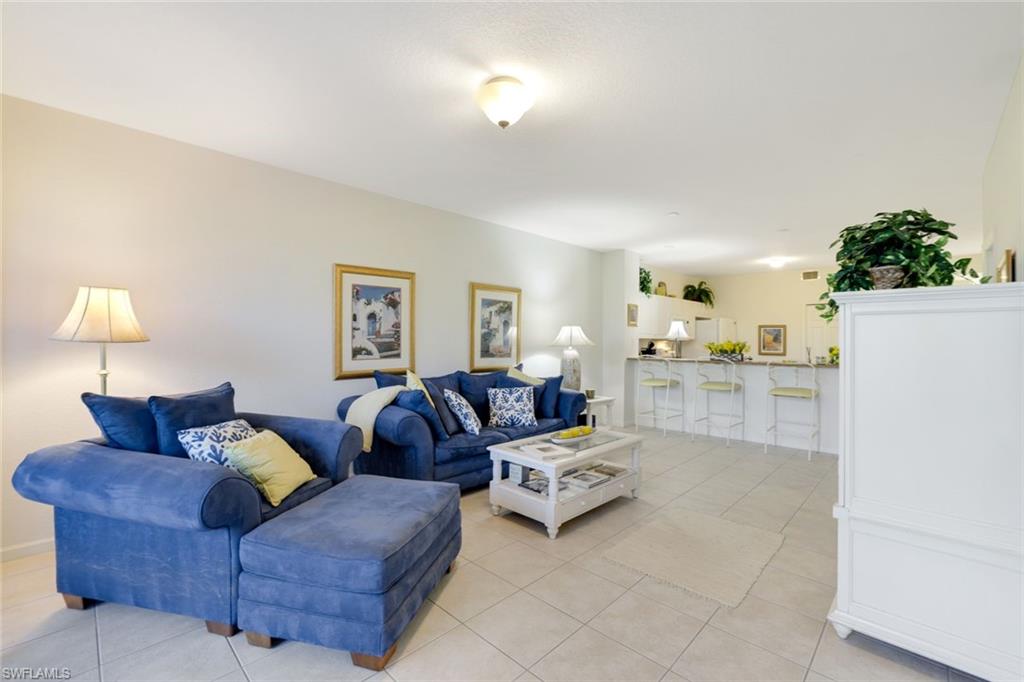 10049 Heather Lane, Unit 101 Naples, FL 34119 - Photo 8 of 28 Living area featuring light tile patterned flooring