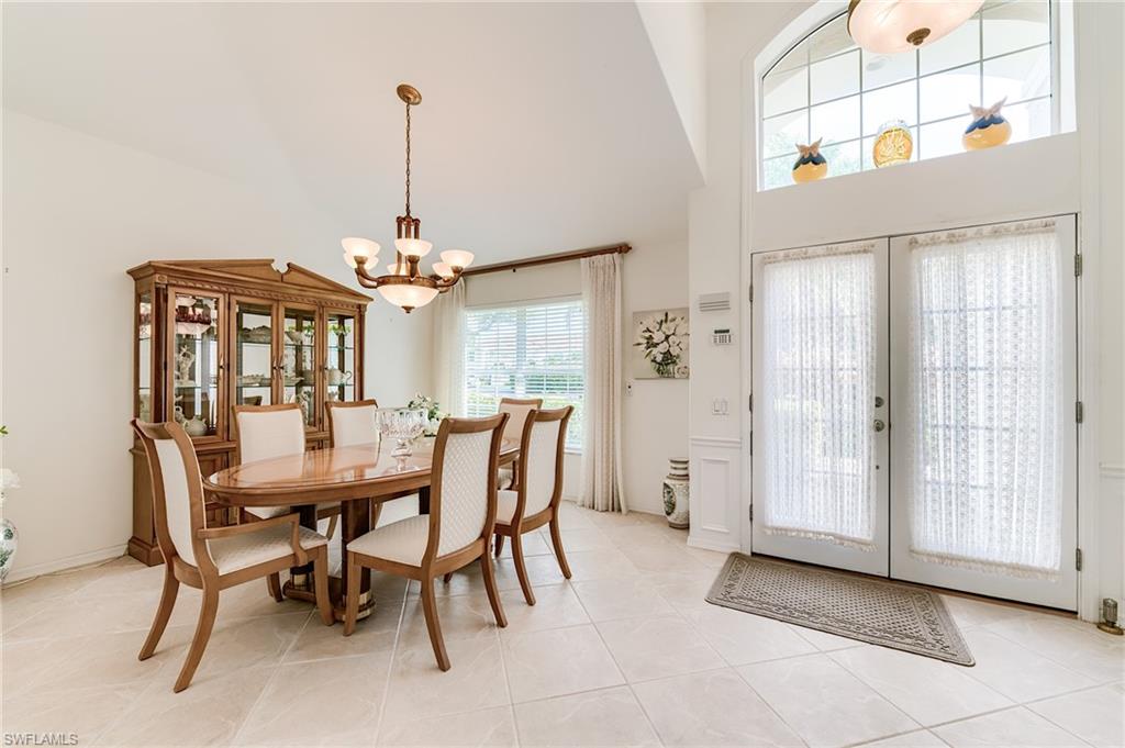 9156 Spring Run Boulevard Estero, FL 34135 - Photo 10 of 34 a view of a dining room with furniture and window