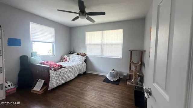 a bedroom with bed and window