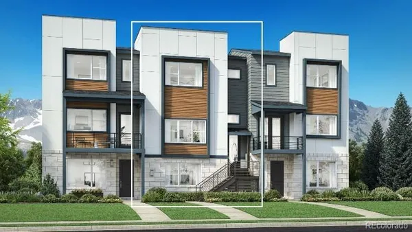a front view of a residential apartment building with a yard