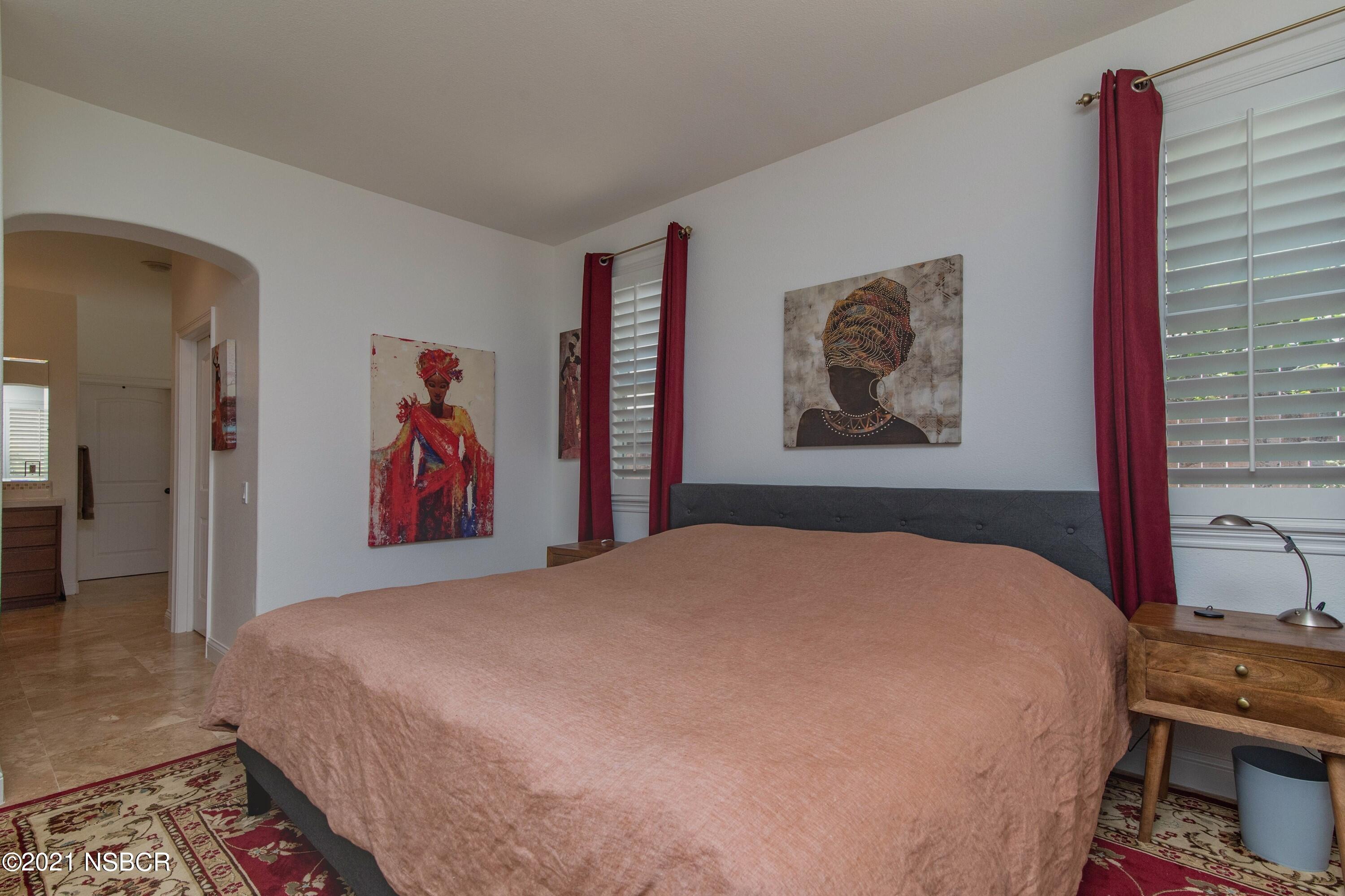 3709 Jupiter Avenue Lompoc, CA 93436 - Photo 11 of 26 a bedroom with a bed and a painting on the wall