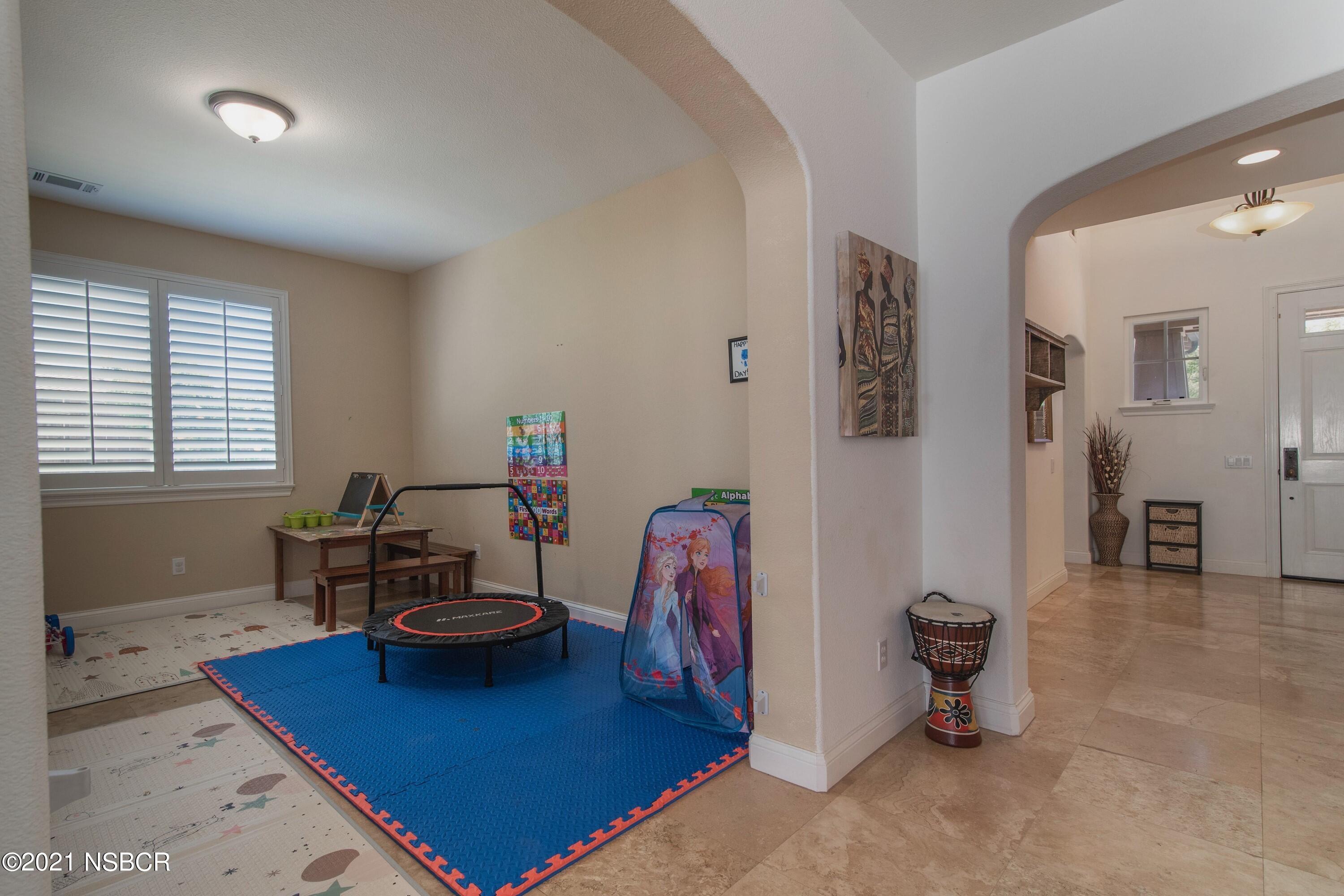 3709 Jupiter Avenue Lompoc, CA 93436 - Photo 15 of 26 a living room with furniture and a table