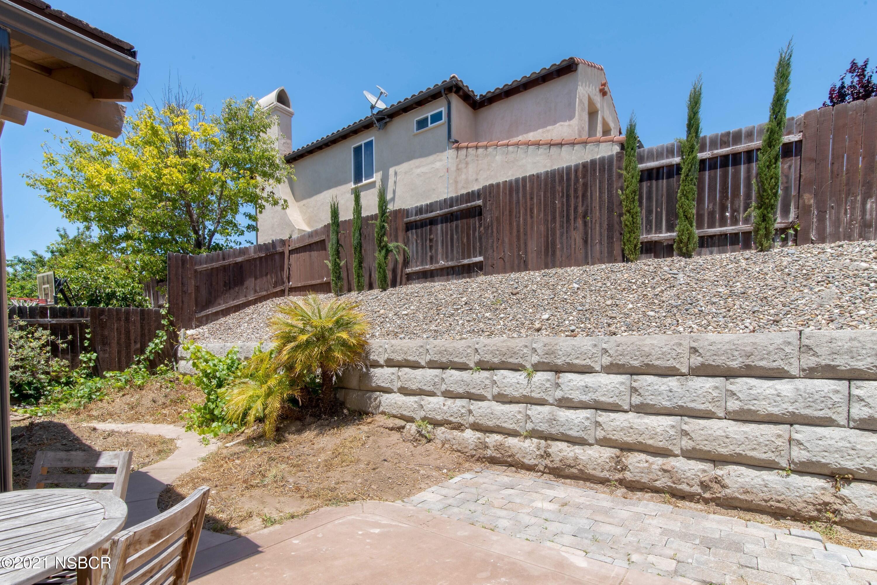 3709 Jupiter Avenue Lompoc, CA 93436 - Photo 24 of 26 a view of a house with a wooden fence