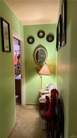 a living room with furniture a rug and a fireplace