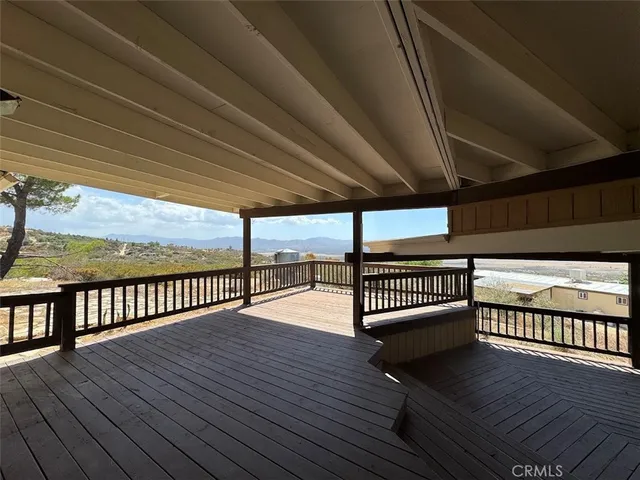 a view of balcony with wooden floor