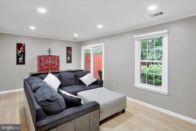 a living room with furniture and a window