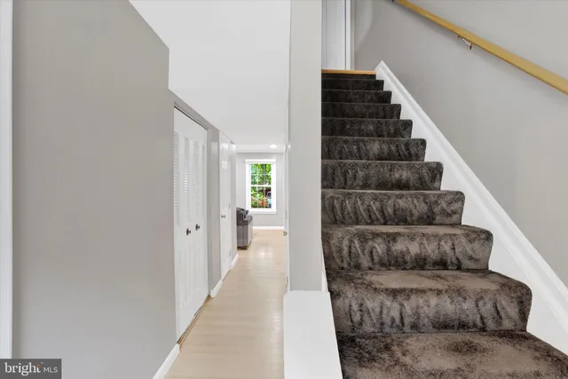 a view of entryway and hall with a couch
