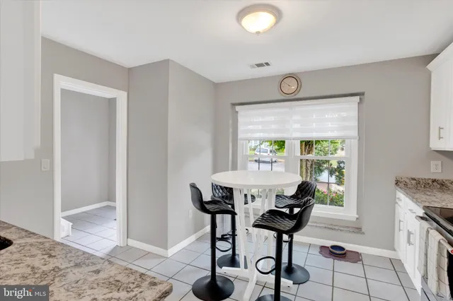 a view of a livingroom with furniture and a window