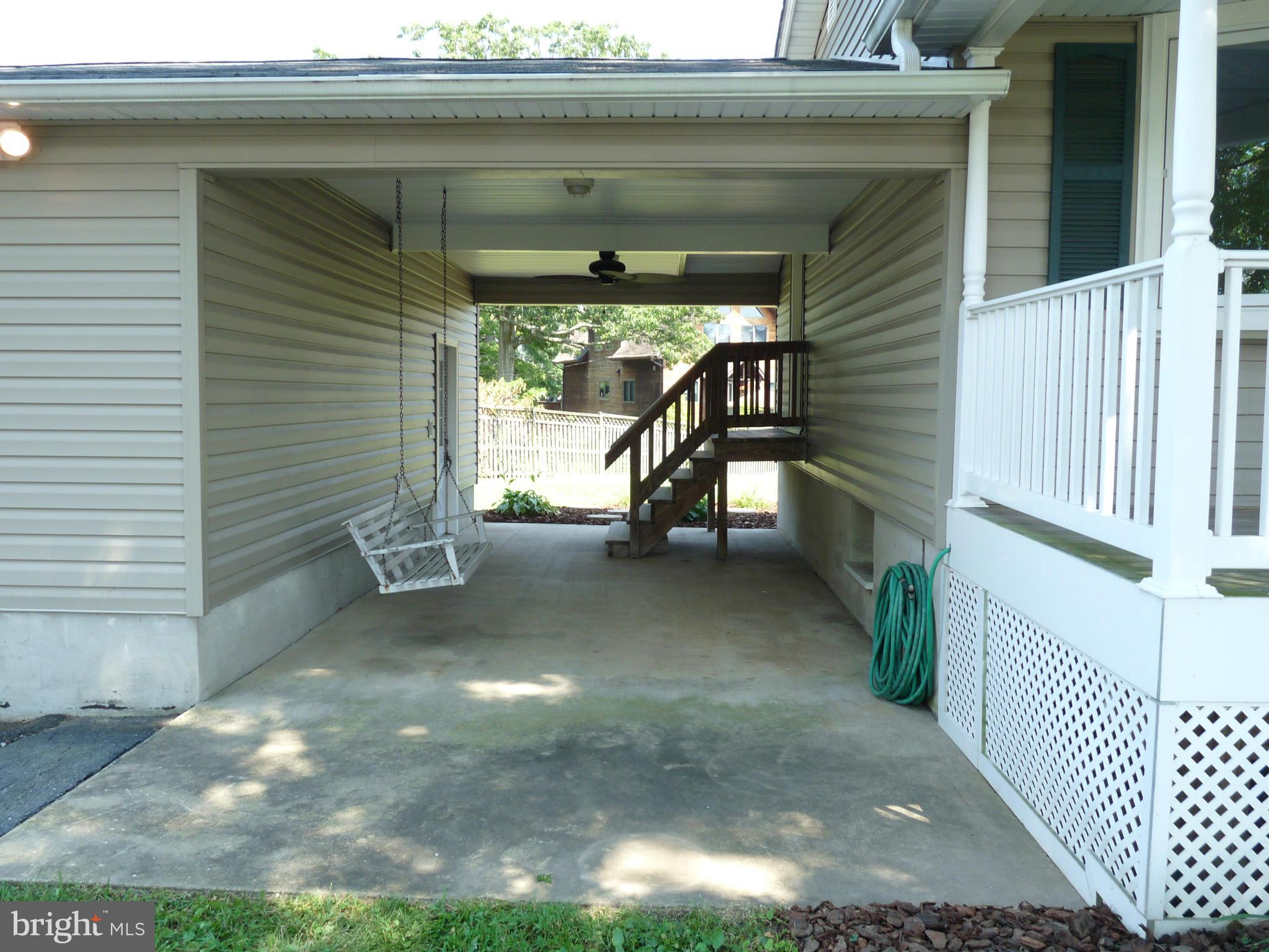 239 St Marys Road Essex, MD 21221 - Photo 3 of 30 Breezeway Area with Swing and Ceiling Fan
