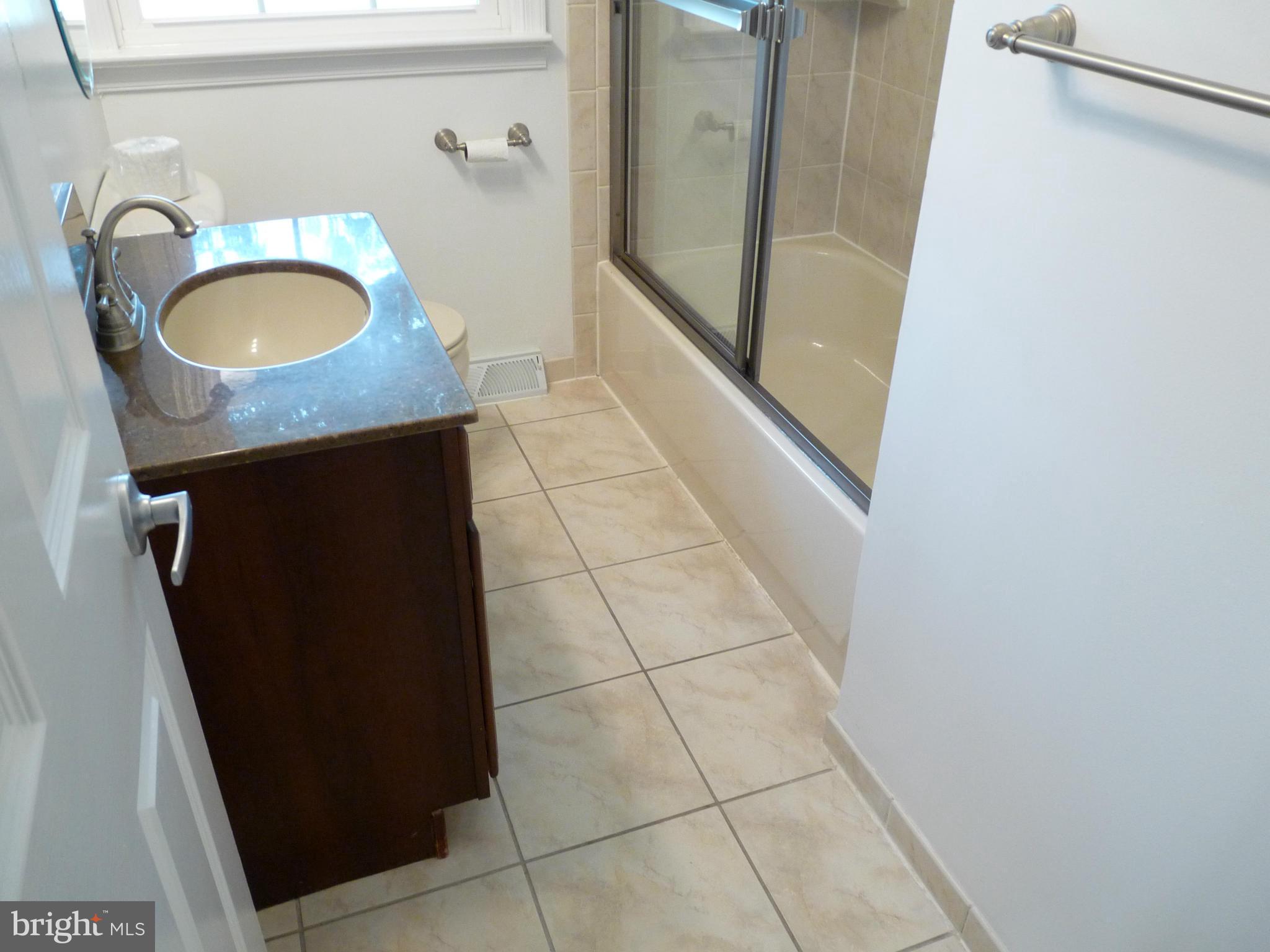 239 St Marys Road Essex, MD 21221 - Photo 22 of 30 Shower / Tub with Ceramic Tile Surround and Doors