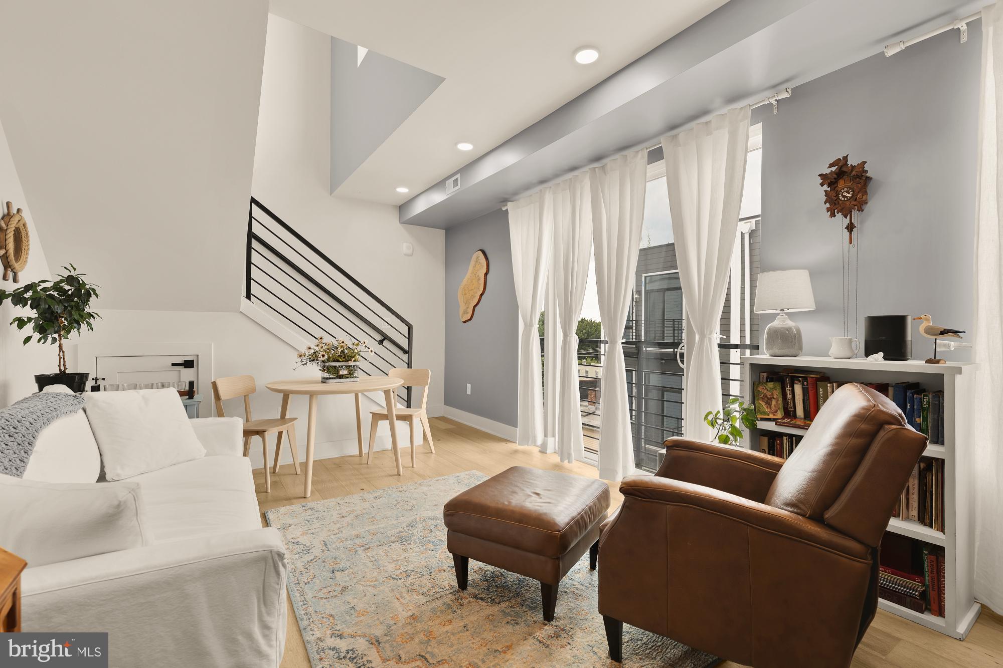 623 Kennedy Street Northwest, Unit 10 Washington, DC 20011 - Photo 11 of 29 a living room with furniture and a large window