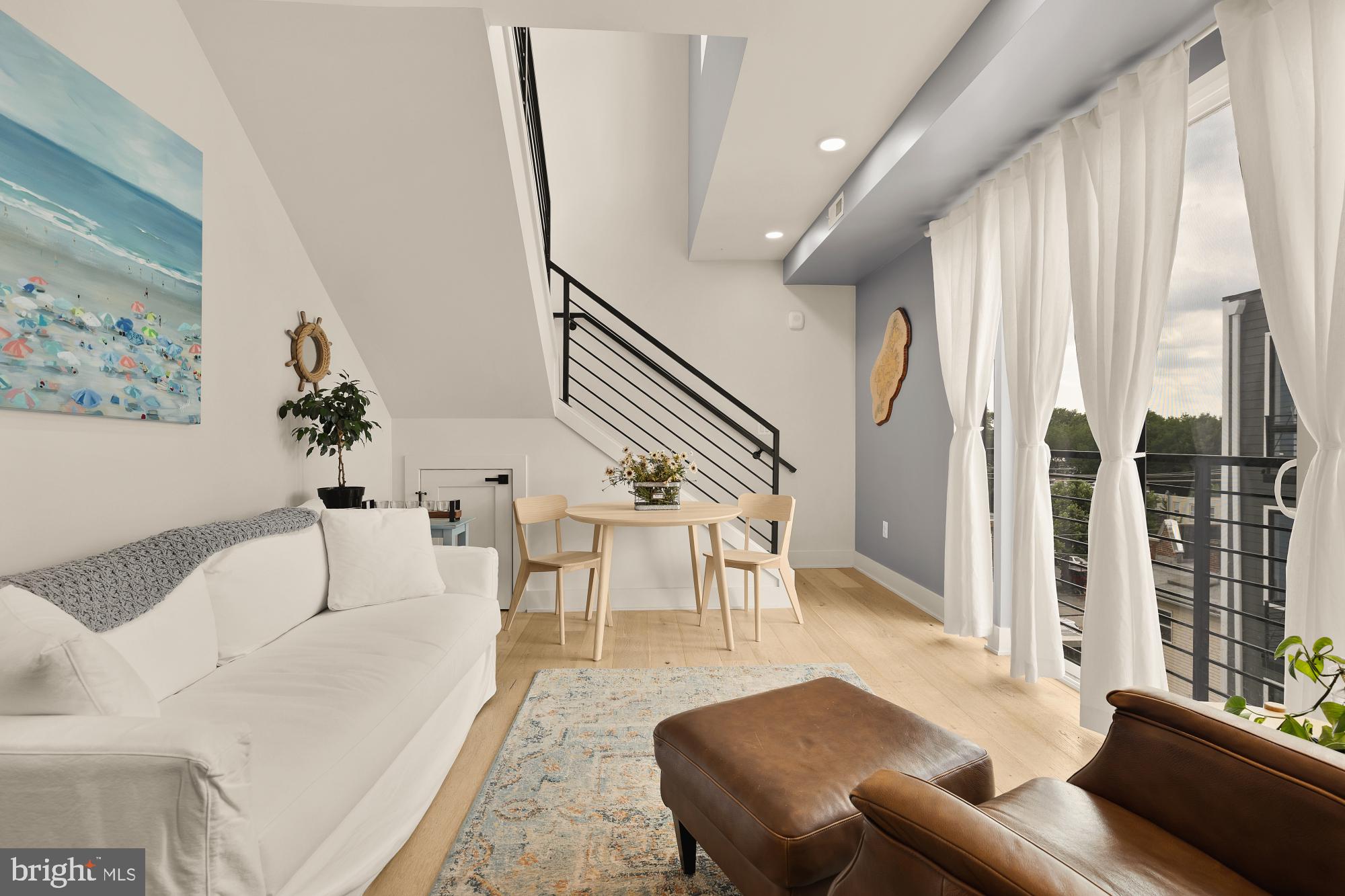 623 Kennedy Street Northwest, Unit 10 Washington, DC 20011 - Photo 12 of 29 a living room with furniture and a large window