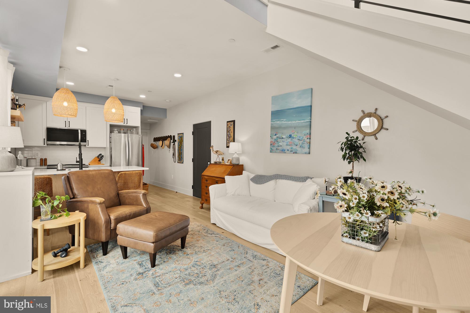 623 Kennedy Street Northwest, Unit 10 Washington, DC 20011 - Photo 14 of 29 a living room with furniture and a chandelier