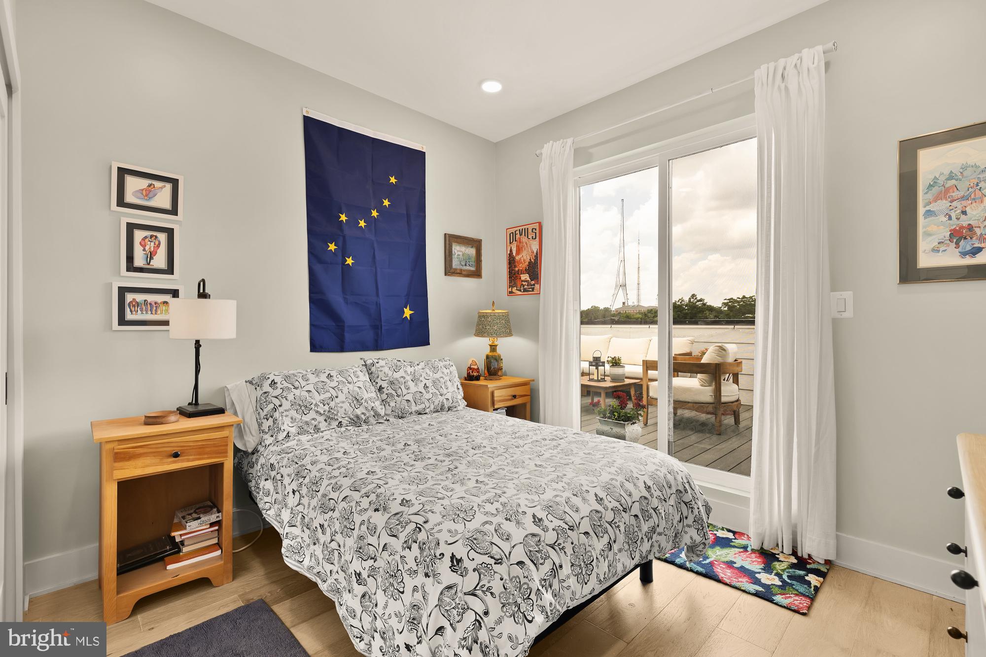 623 Kennedy Street Northwest, Unit 10 Washington, DC 20011 - Photo 17 of 29 a bedroom with a bed and wooden floor