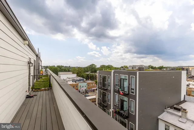 a view of a balcony with city view