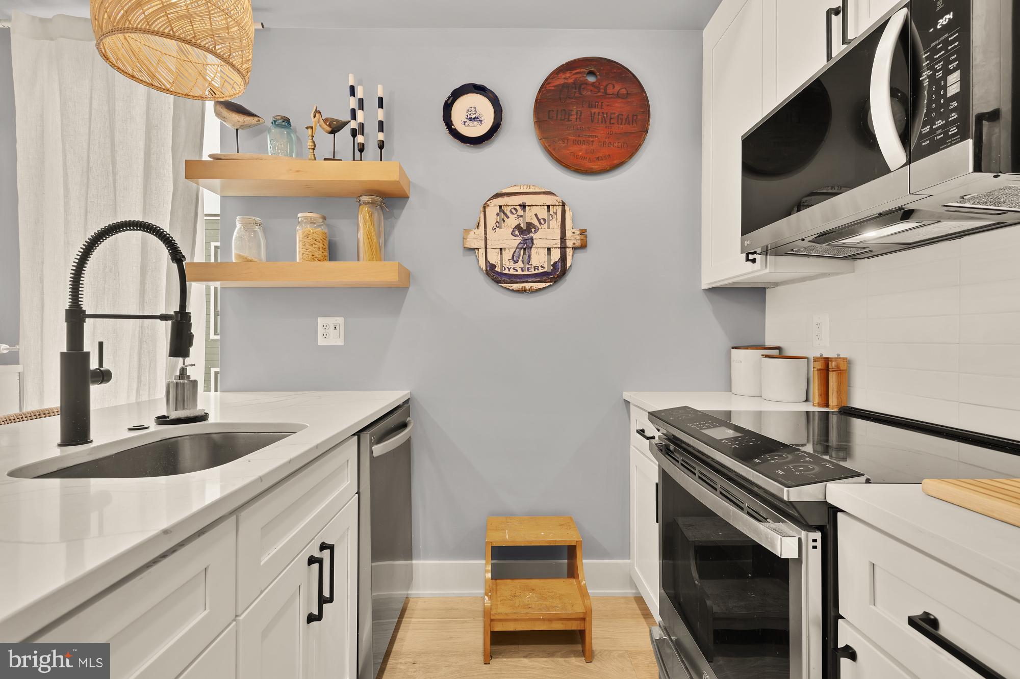 623 Kennedy Street Northwest, Unit 10 Washington, DC 20011 - Photo 7 of 29 a kitchen with stainless steel appliances granite countertop a sink and a stove