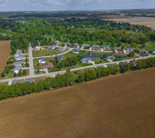 a view of a street with a yard
