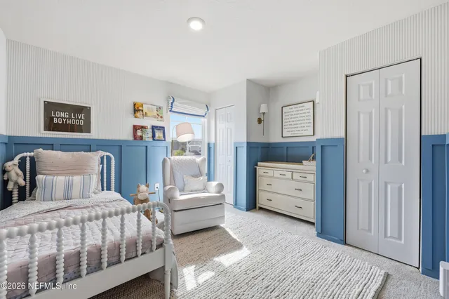 a bedroom with furniture and white walls