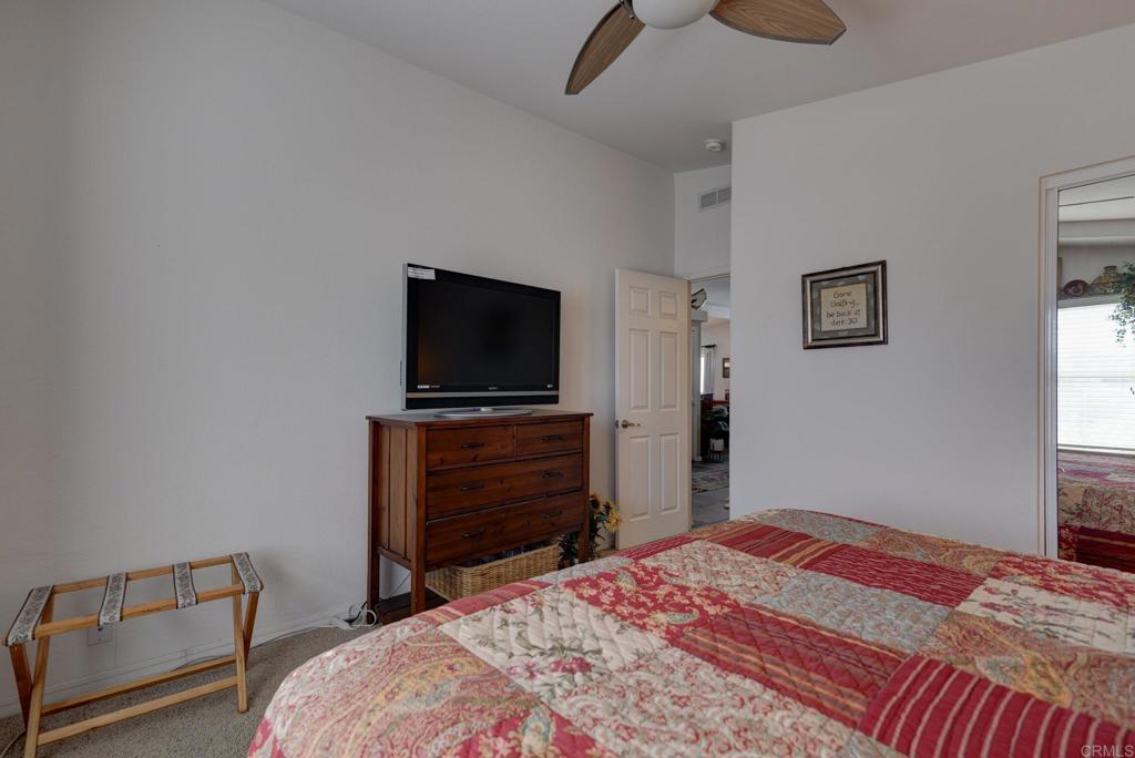 1010 Palm Canyon Drive, Unit 368 Borrego Springs, CA 92004 - Photo 15 of 23 a bedroom with a bed and a flat screen tv