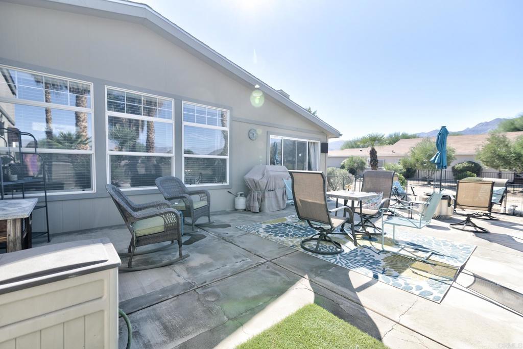1010 Palm Canyon Drive, Unit 368 Borrego Springs, CA 92004 - Photo 19 of 23 a building outdoor space with patio furniture and potted plants